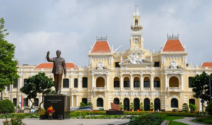 Ho Chi Minh statue in front of Ho Chi Minh City Hall under warm afternoon light, District 1, Saigon