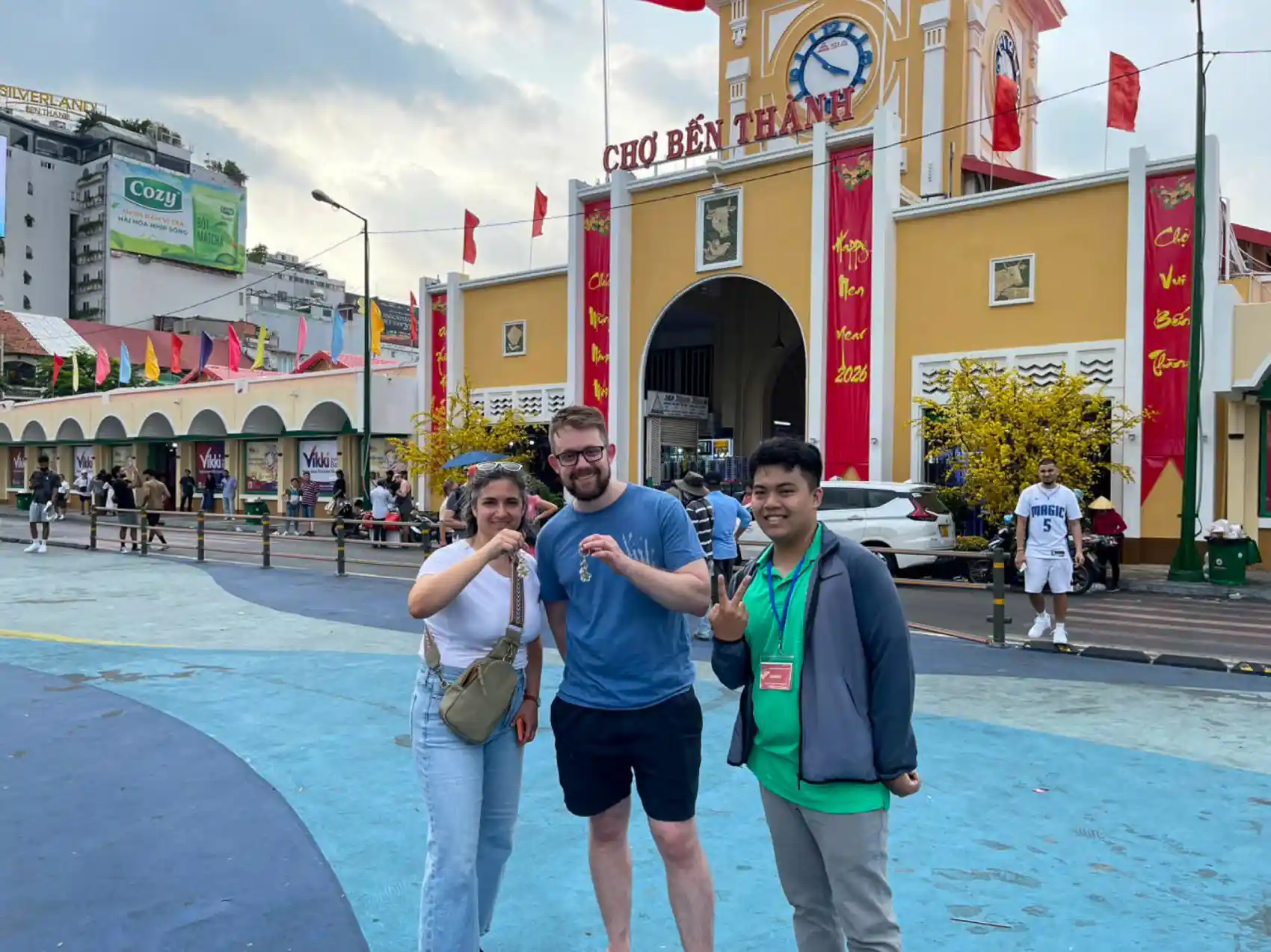 Travellers meeting their local guide in front of Ben Thanh Market on a Free Walking Tour Ho Chi Minh City