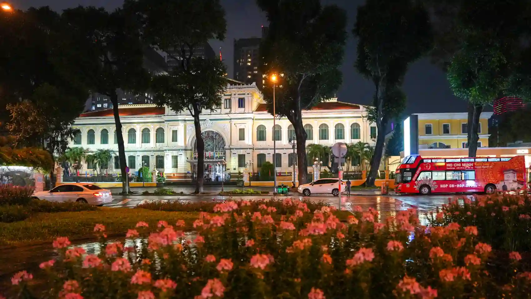 Saigon Central Post Office illuminated at night in Ho Chi Minh City Vietnam