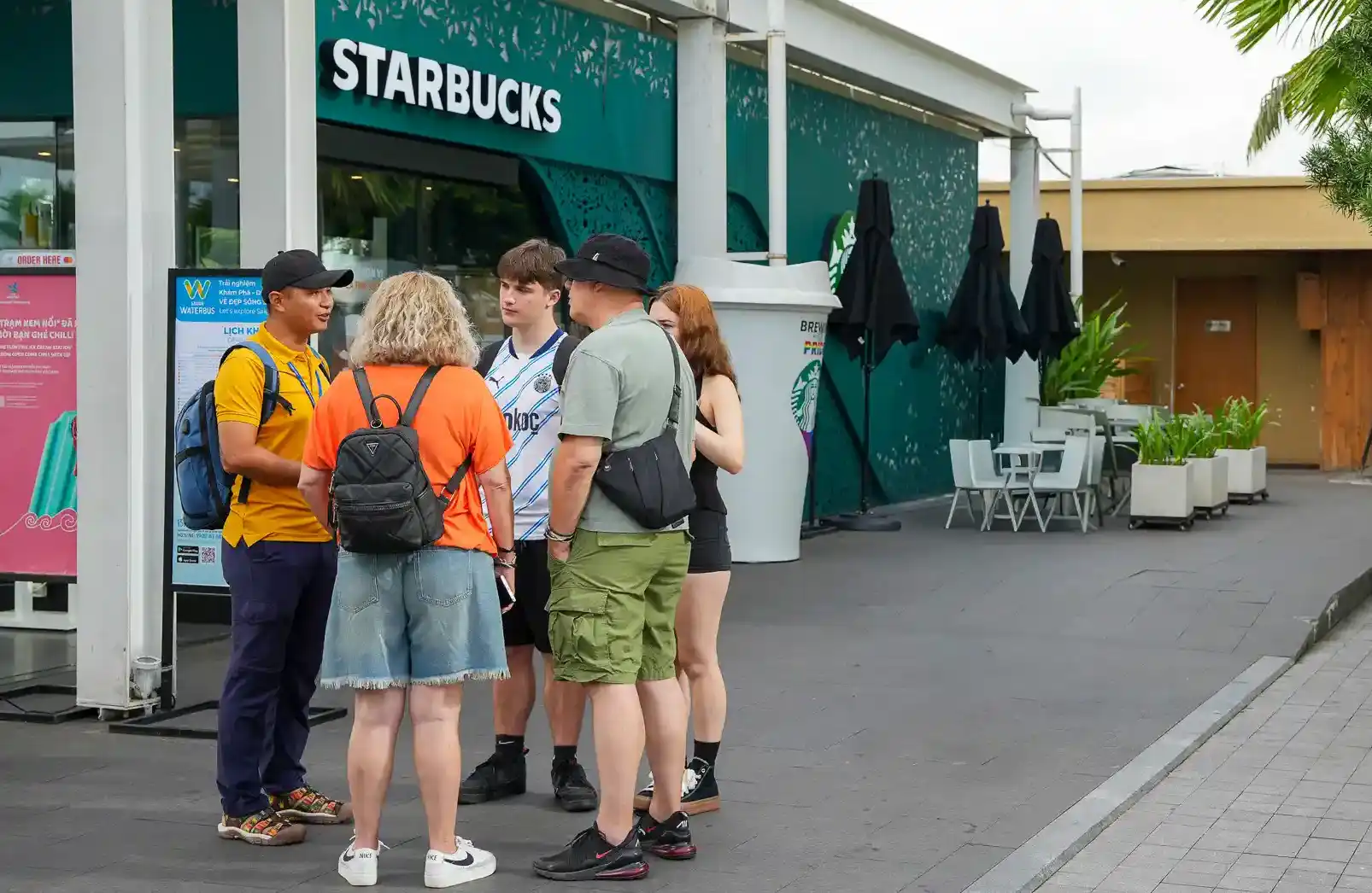 Travellers meeting a local guide at Bach Dang Wharf in Ho Chi Minh City