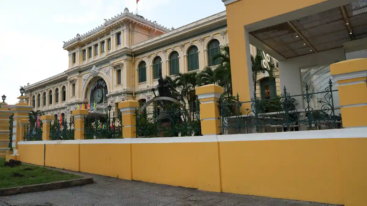 Yellow façade of the Saigon Central Post Office seen from the Notre Dame Cathedral square in District 1, Ho Chi Minh City