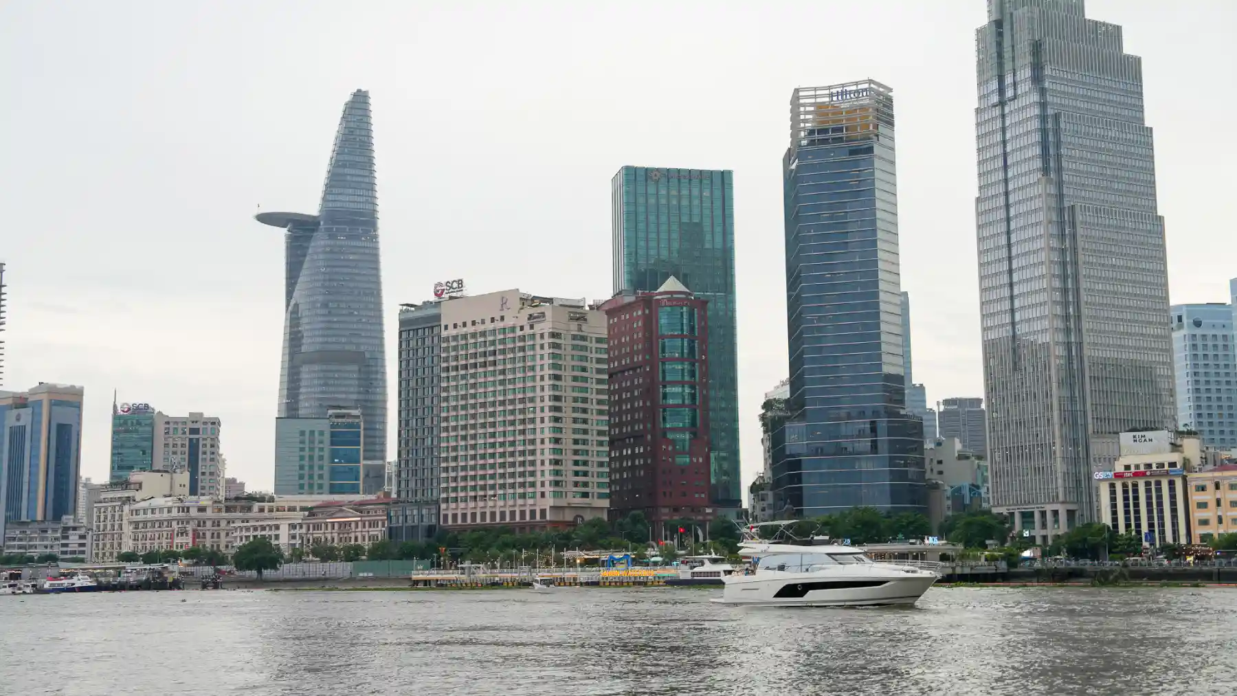 Saigon skyline at dusk from the riverfront with Bitexco Financial Tower above District 1, Ho Chi Minh City